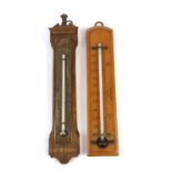 Two wall thermometers, largest 25cm.