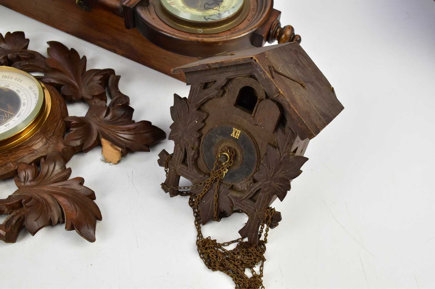 A Black Forest carved wood combination barometer and therometer, length 55cm, with two cuckoo clocks - Image 3 of 4