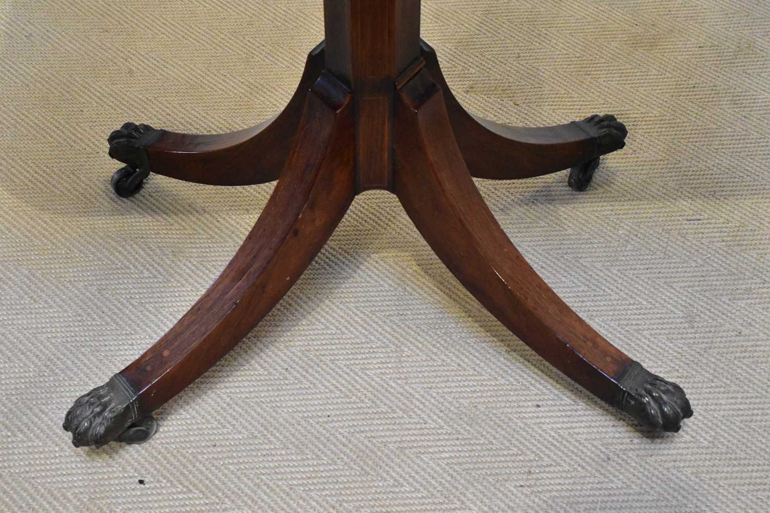 A near pair of Regency rosewood card tables, each with a swivel top on an octagonal column and - Image 3 of 4