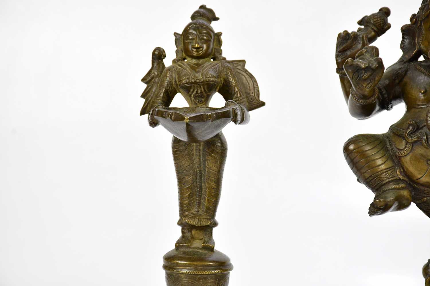 A bronze figure of Ganesh, together with a pair of bronze wick lamps, height of largest 29cm. - Image 4 of 8