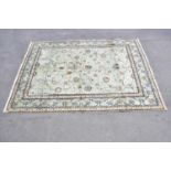 A pale blue wool carpet with floral pattern, 400 x 300cm. Condition Report: Worn corner and small