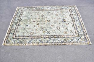 A pale blue wool carpet with floral pattern, 400 x 300cm. Condition Report: Worn corner and small