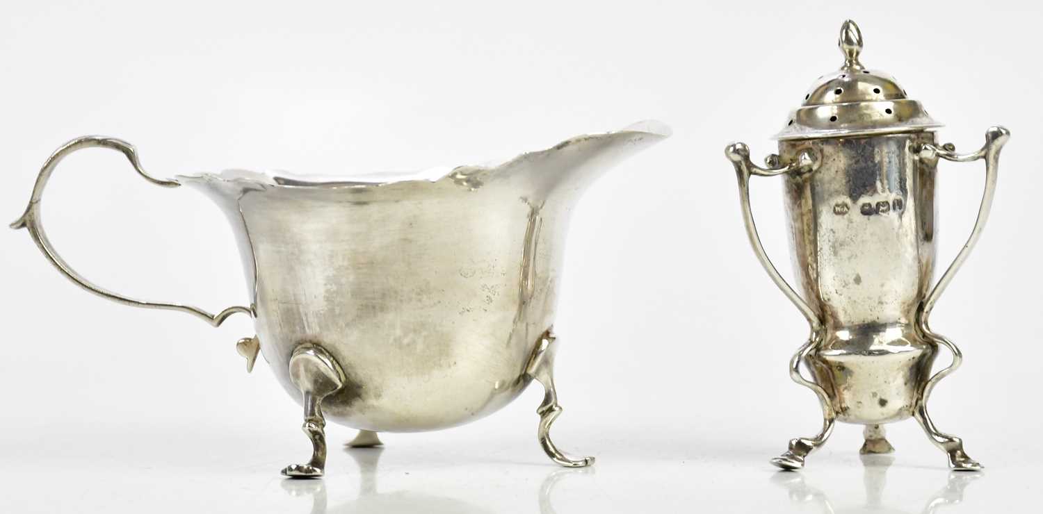 HORACE WOODWARD & CO LTD; a George V hallmarked silver cream jug, London 1912, together with a