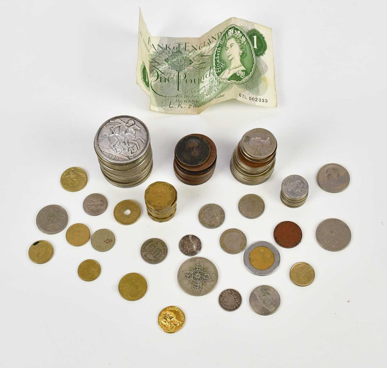 A small collection of coins to include silver crowns, half crowns, threepences, commemorative coins,