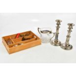 A pair of 19th century Sheffield plate tapering candlesticks, a biscuit barrel with silver plated