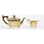 VINERS; a George VI hallmarked silver teapot and cream jug with panel decoration, Sheffield 1937-38,