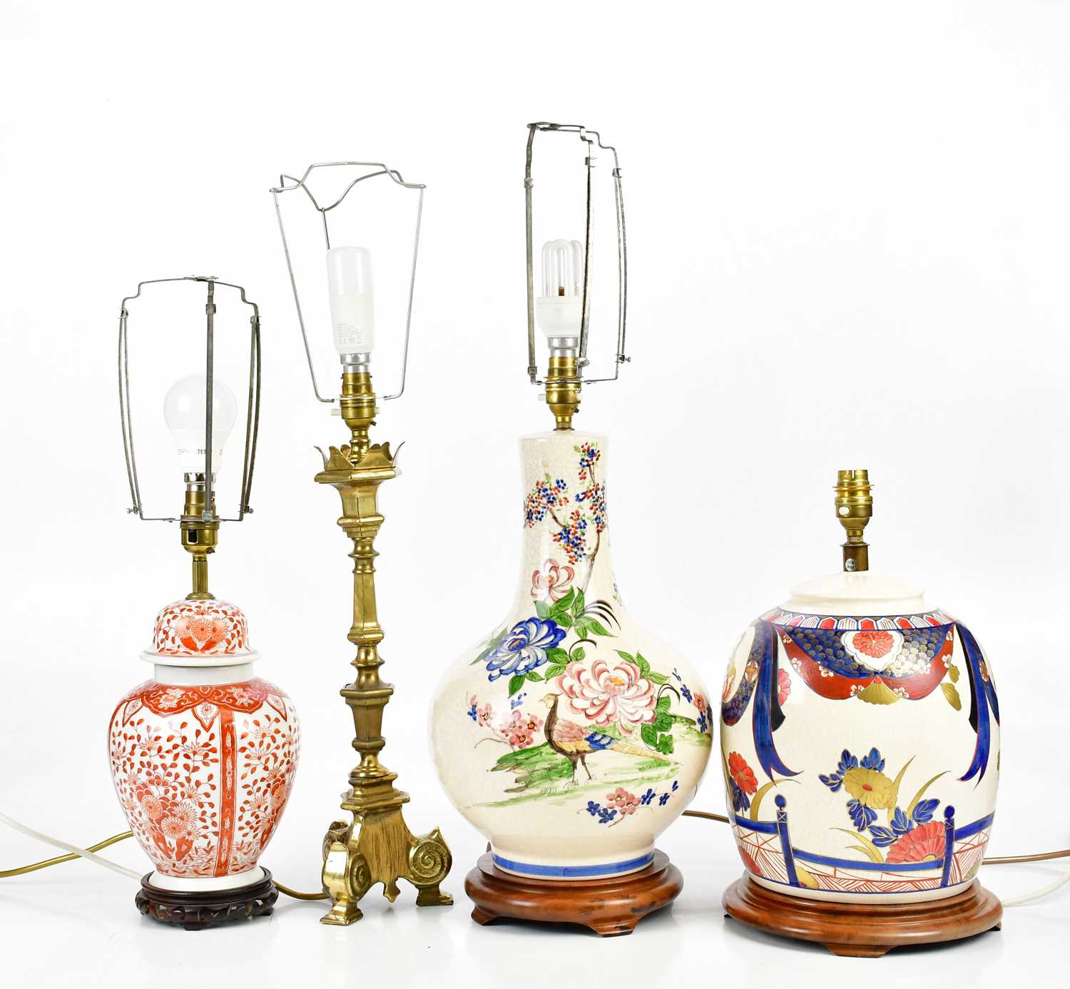 Four decorative table lamps including a brass example, crackle glazed example, etc, height of