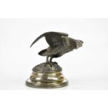 A 19th century spelter inkwell in the form of an eagle, on electroplated base, height 16cm.