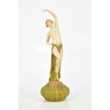 ROYAL DUX, an Art Nouveau figure of a nude dancer, on lotus flower base, height 27cm.