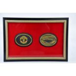 MANCHESTER UNITED INTEREST; two rare Wedgwood black jasperware oval panels, the first with the