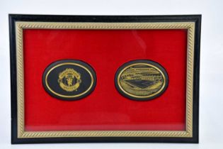 MANCHESTER UNITED INTEREST; two rare Wedgwood black jasperware oval panels, the first with the