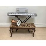YAMAHA; a Portable Grand NP-30 keyboard, with a folding stand, associated duet stool and a