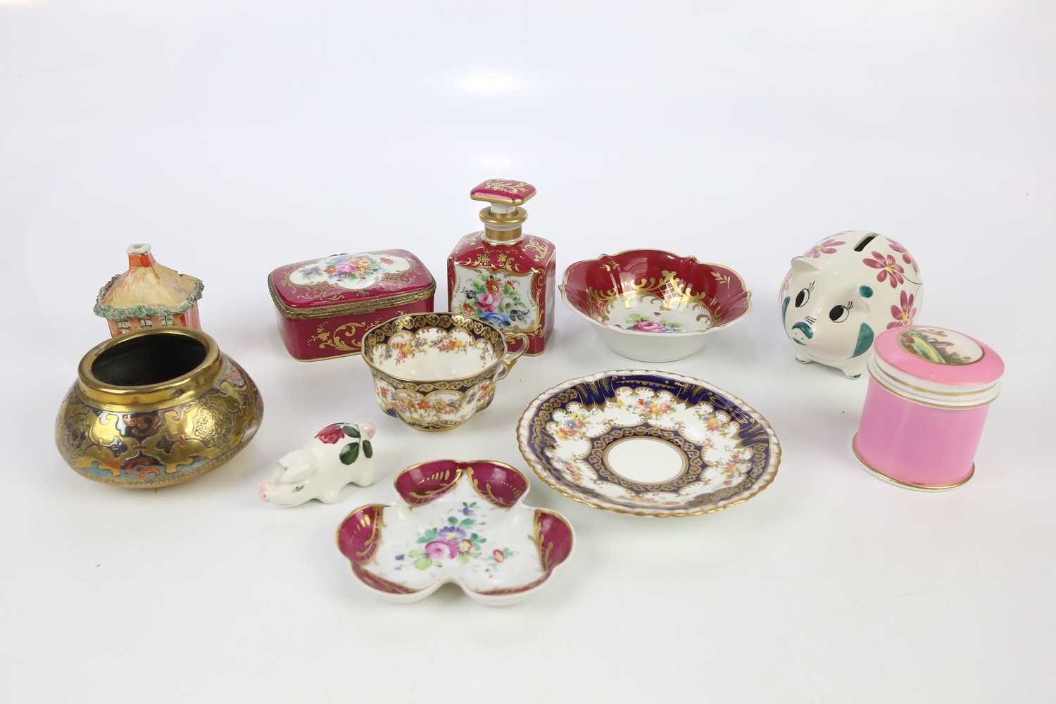 A Limoges four piece dressing table set, to include a scent bottle and stopper, with an Indian white