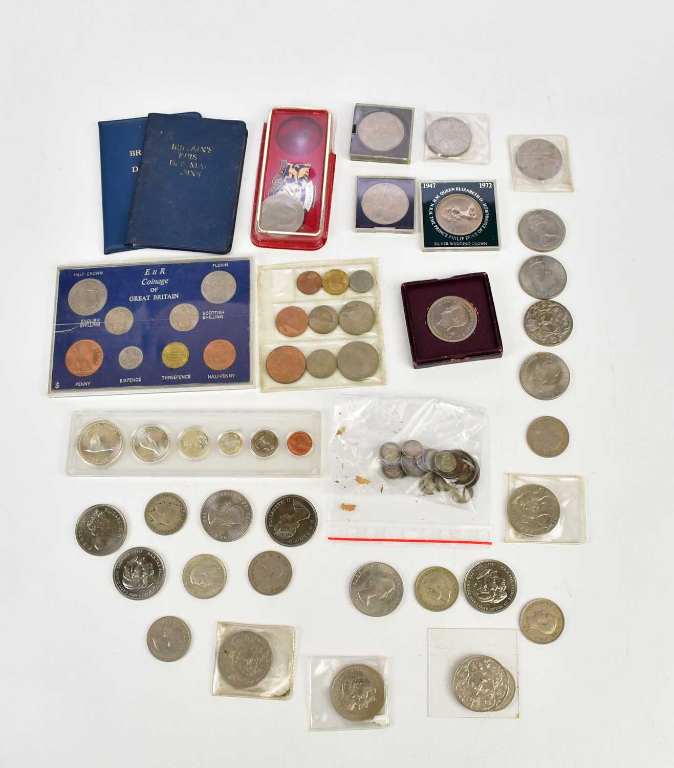 A collection of predominantly British coins including commemorative crowns, various threepence