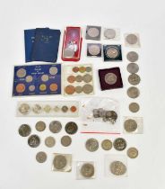 A collection of predominantly British coins including commemorative crowns, various threepence