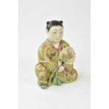 A Japanese Meiji period Satsuma figure of a seated young woman holding decorated fan in her right