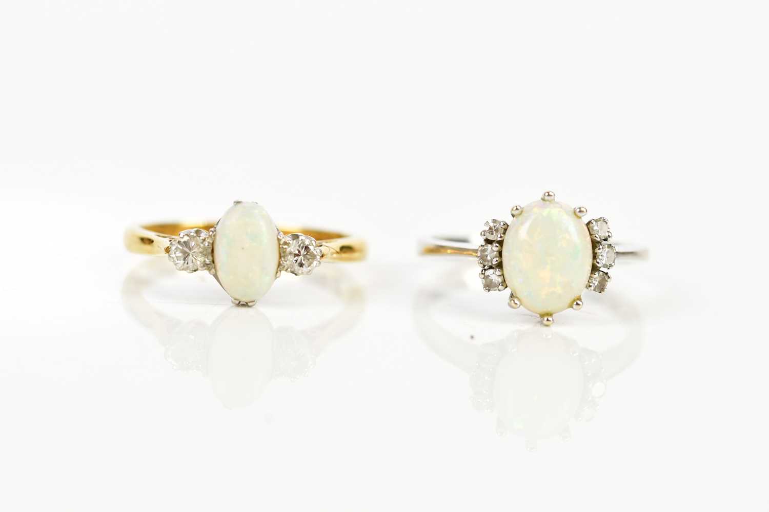 An 18ct white gold diamond and opal set dress ring, size J, and an 18ct gold and platinum diamond