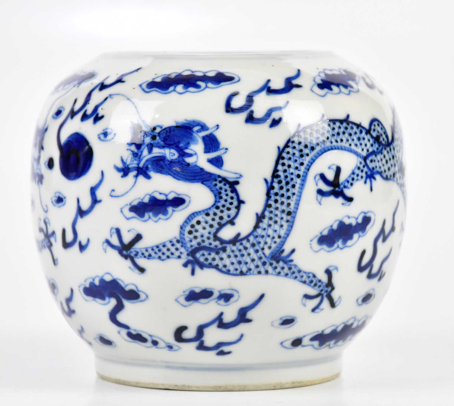 A late 19th century Chinese blue and white globular vase, decorated with a four claw dragons chasing