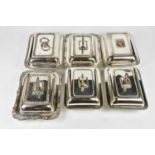 Six silver plated entree dishes and covers (one lacking handle).