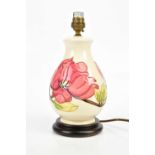 MOORCROFT; a baluster shaped table lamp in the 'Magnolia' pattern, on plinth, height including