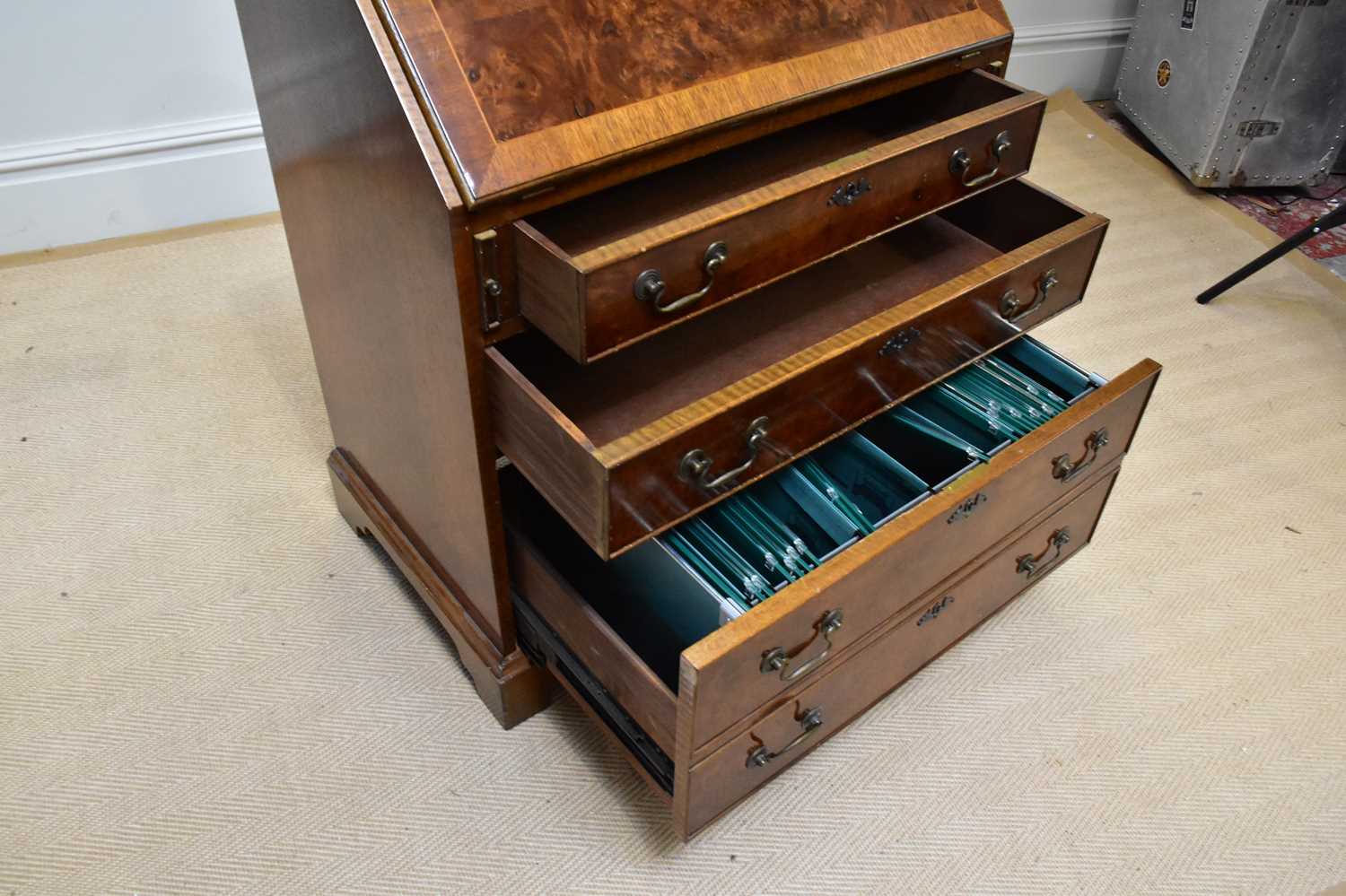 A reproduction walnut bureau, the fall front enclosing fitted interior above four drawers, on - Image 3 of 3