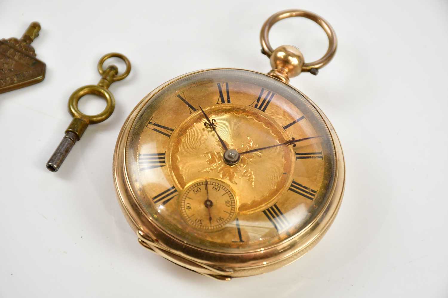 A yellow gold cased open face pocket watch with Roman numerals to the engraved dial, stamped 9K, - Image 2 of 4