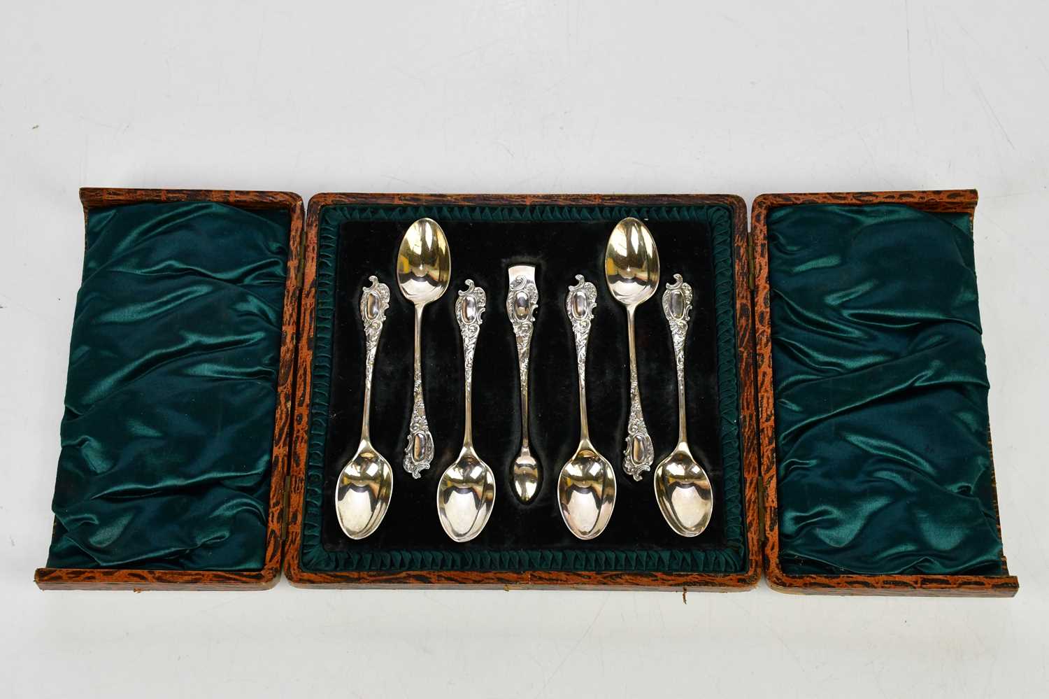 WALKER & HALL; a cased set of six Victorian hallmarked silver tea spoons and sugar tongs,