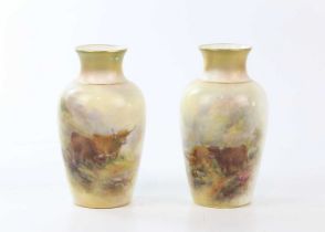 HARRY STINTON FOR ROYAL WORCESTER; a pair of hand painted vases decorated with Highland cattle,