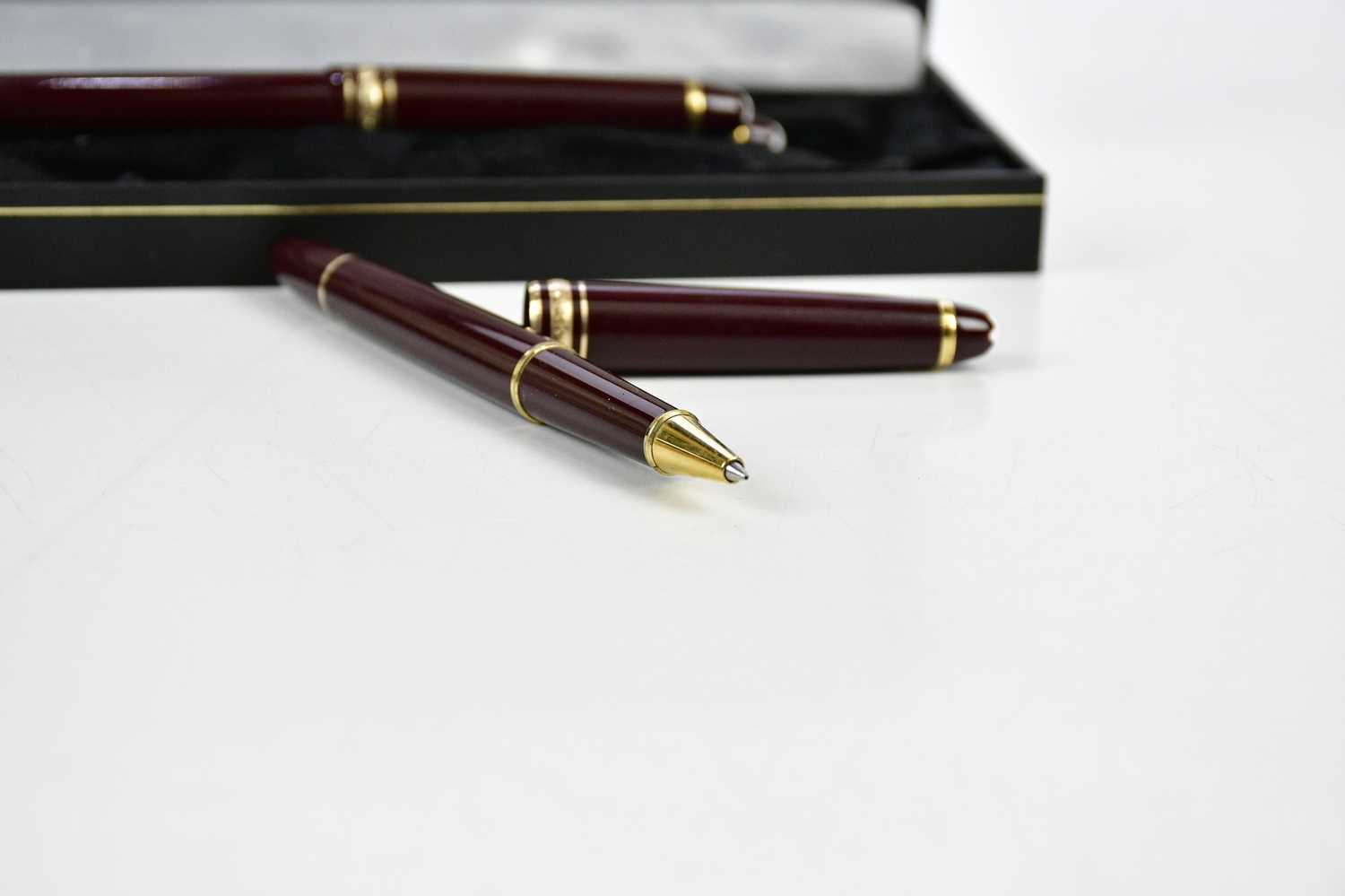 MONTBLANC; a set of three Meisterstuck burgundy pens including a cartridge fountain pen with 14K - Image 3 of 3