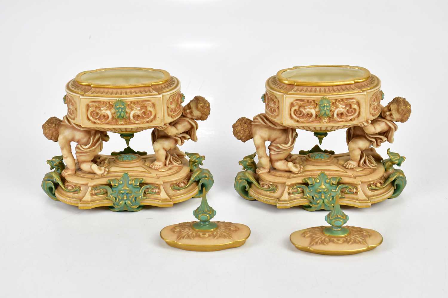 ROYAL WORCESTER; a pair of unusual lidded urn vases of oval form, the urns supported by cherubs on a - Bild 5 aus 6