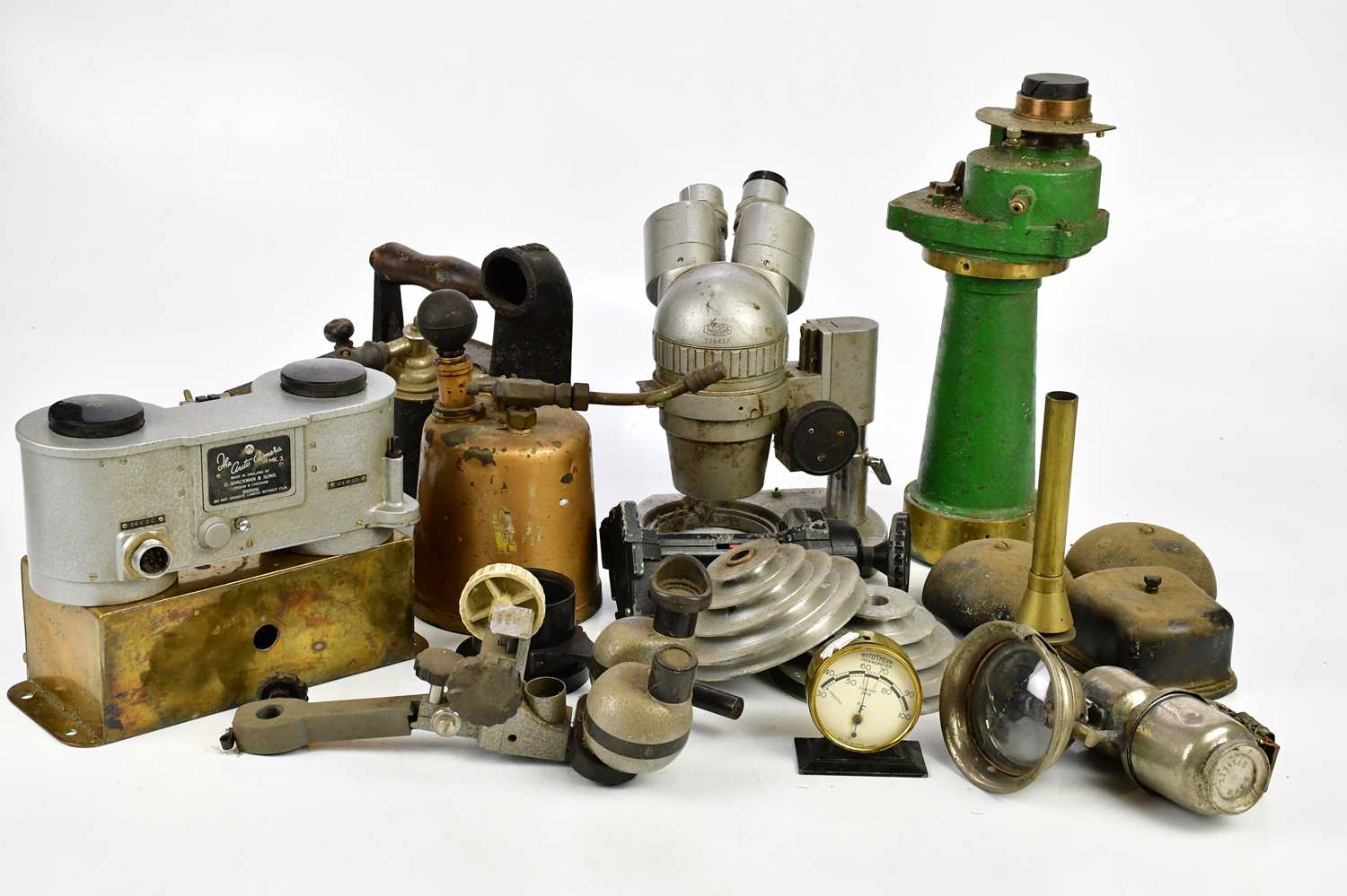 A collection of scientific instruments and metalware items to include a Shackman & Sons autocamera