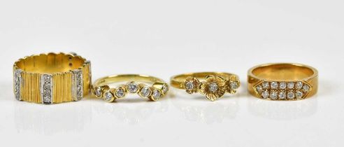 An 18ct yellow gold diamond set floral dress ring, approx size L, an 18ct yellow gold seven stone