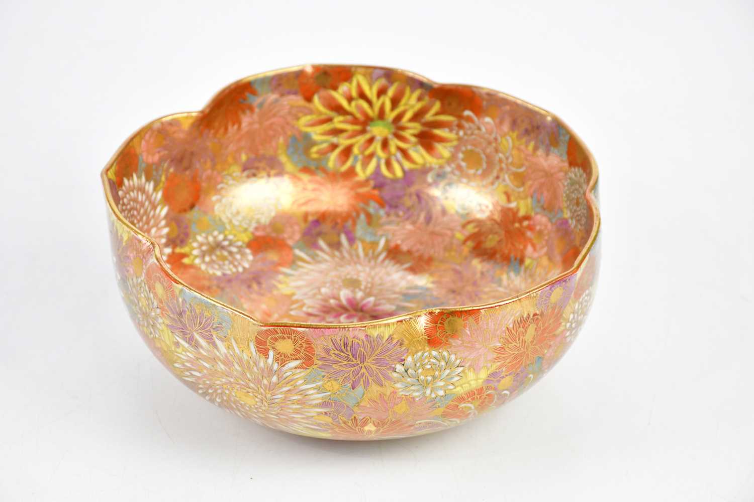 A Japanese Meiji period Satsuma bowl, finely painted with chrysanthemums and floral edge, diameter