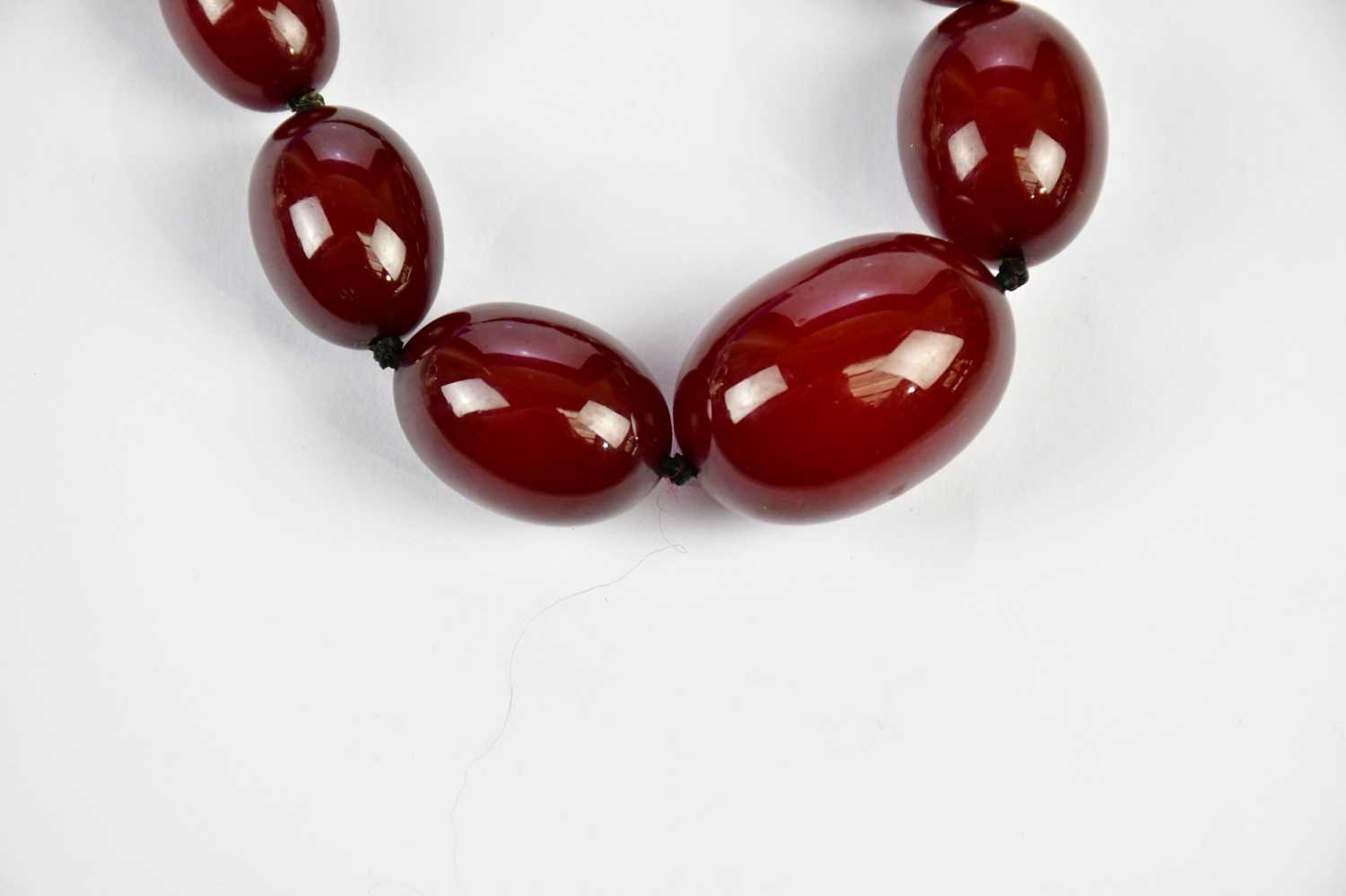 A cherry amber beaded necklace, length 43cm, approximate weight 44.4g. Condition Report: As - Image 2 of 9