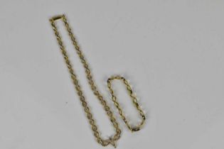 A yellow metal diamond set rope twist necklace, length 42cm, and a matching bracelet, combined