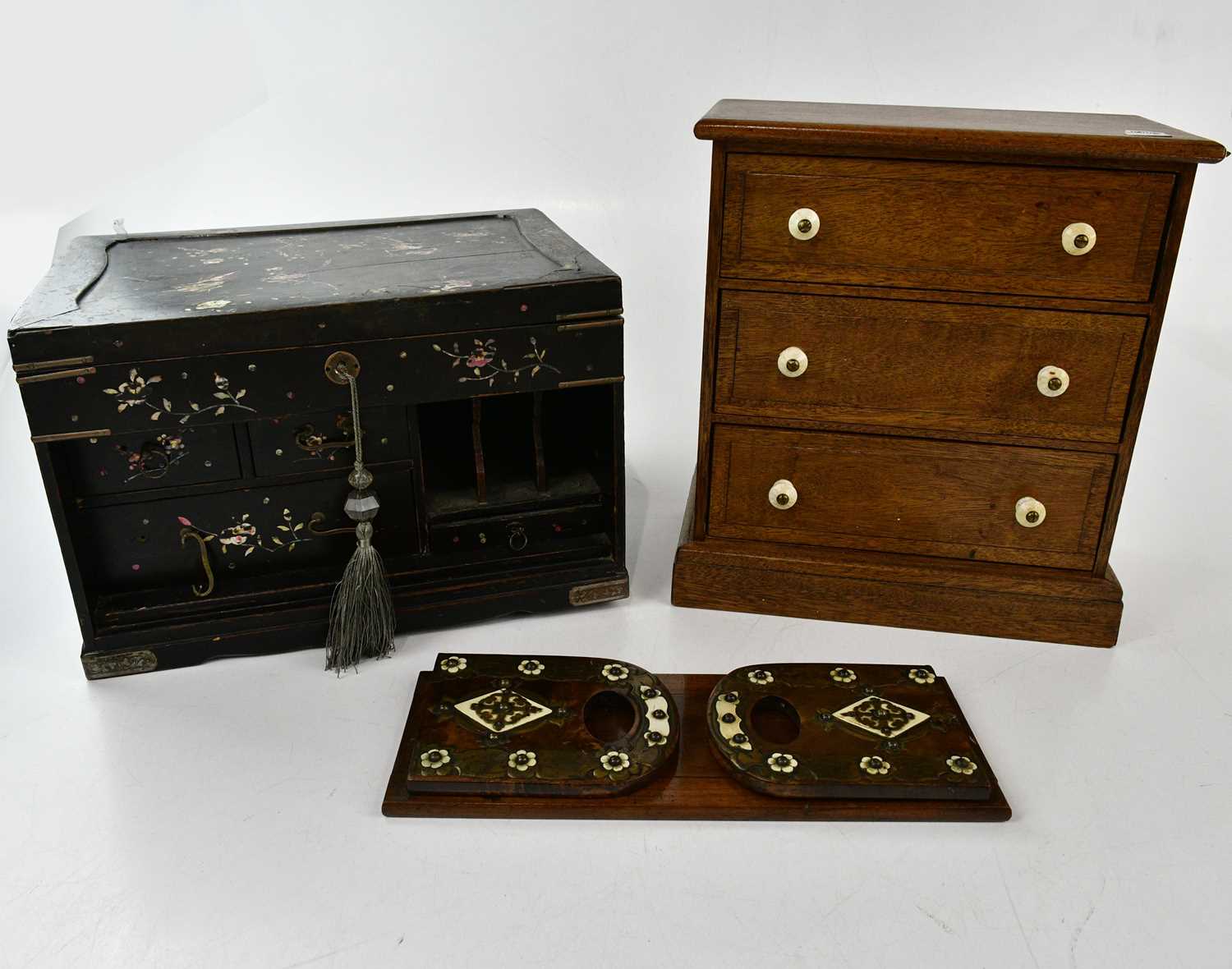 An early 20th century Japanese lacquered jewellery cabinet with mother of pearl inlaid decoration