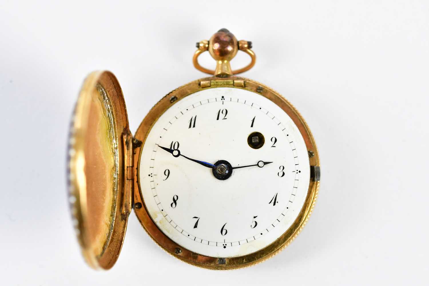 An early 20th century yellow metal and enamelled cased lady's full hunter fob watch, set with seed