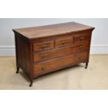 An early 20th century chest of three short over two long drawers, on turned column legs, length