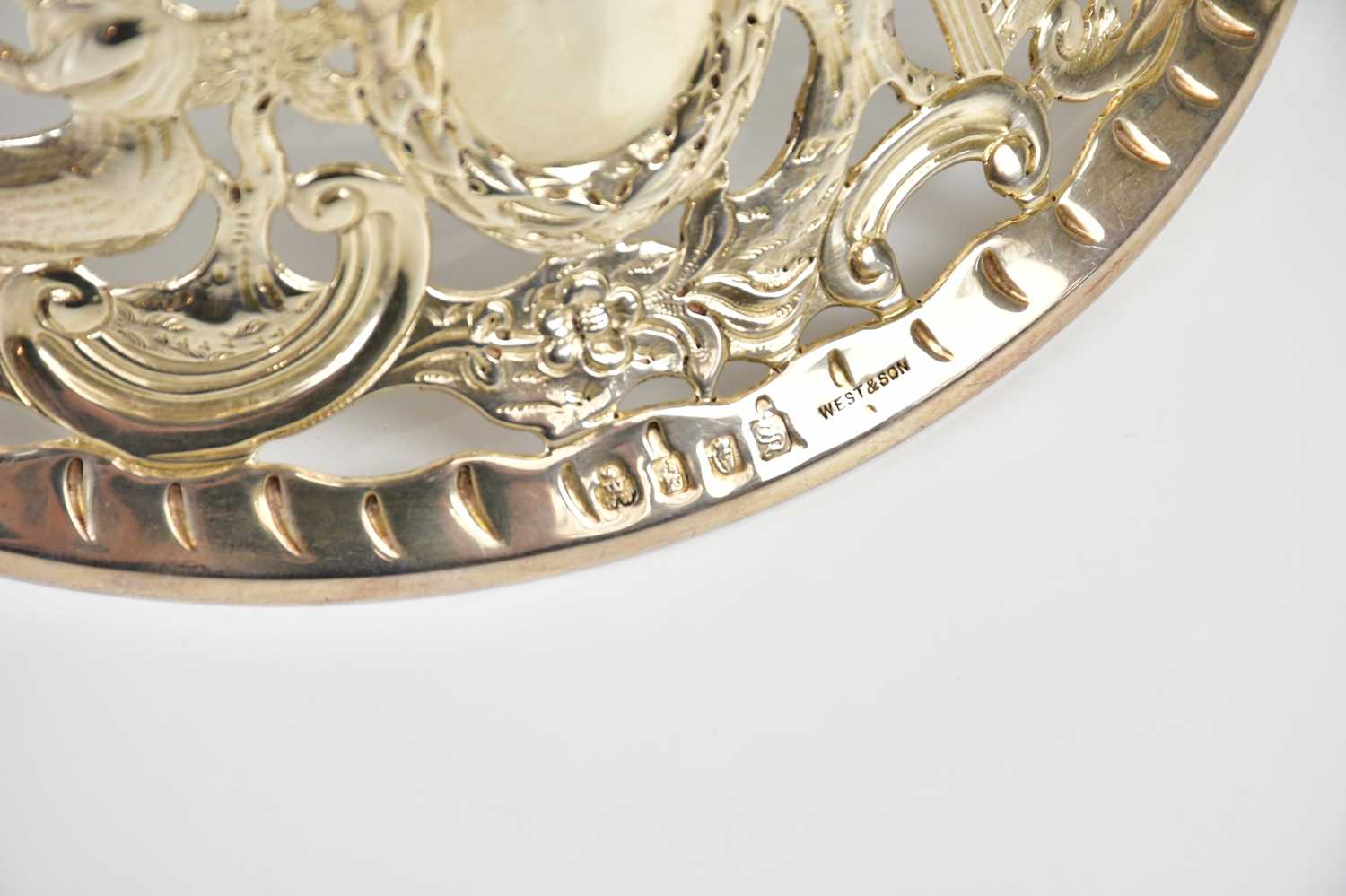 WEST & SON; a George V hallmarked silver dish/potato ring, with cast decoration depicting the Pied - Image 7 of 7