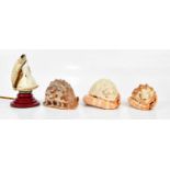 Three decorative carved conch shells including two shades and an un-carved example, one of the