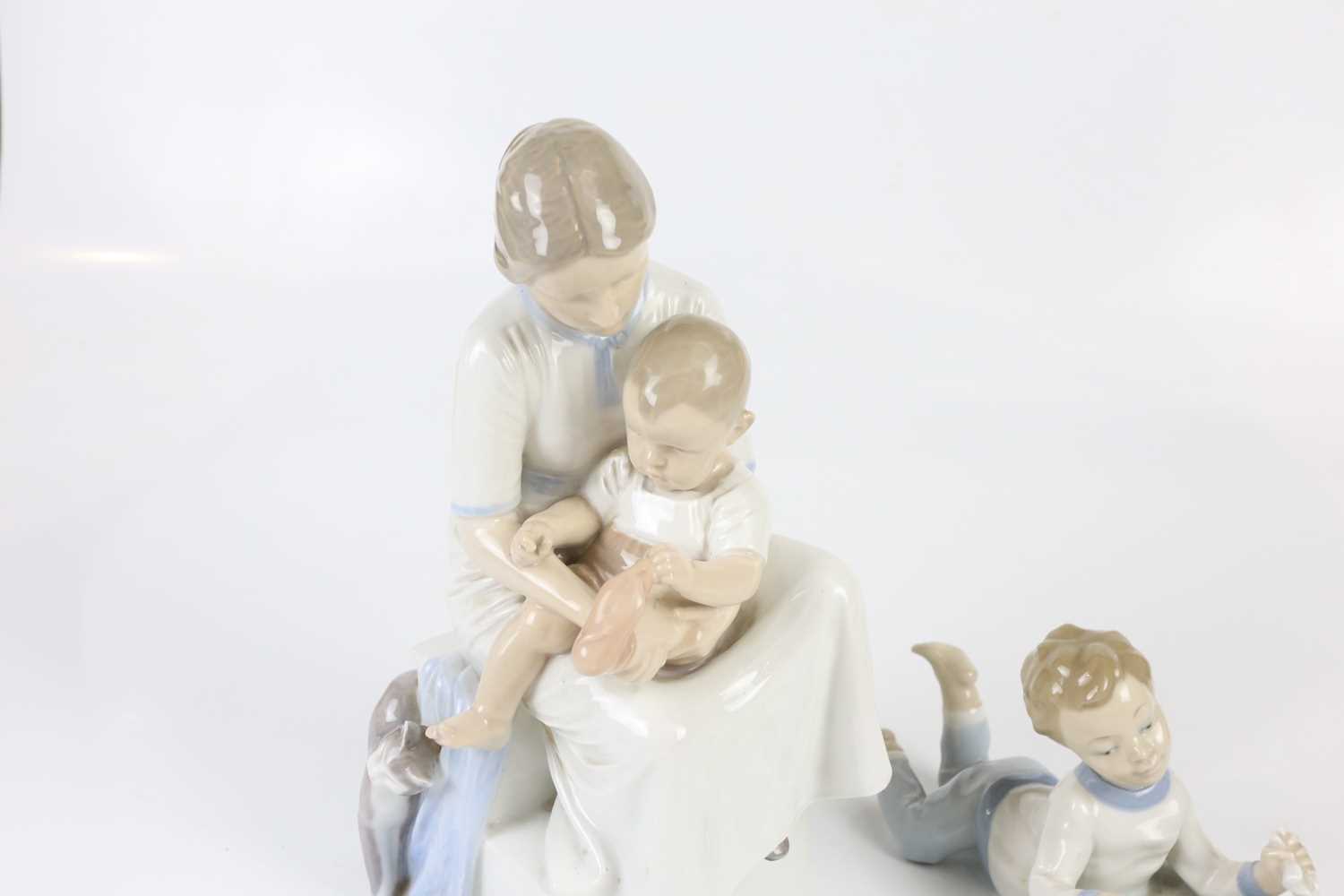 ROYAL COPENHAGEN; a figure group of mother and child, height 32cm, together with a Nao figure of - Image 2 of 4