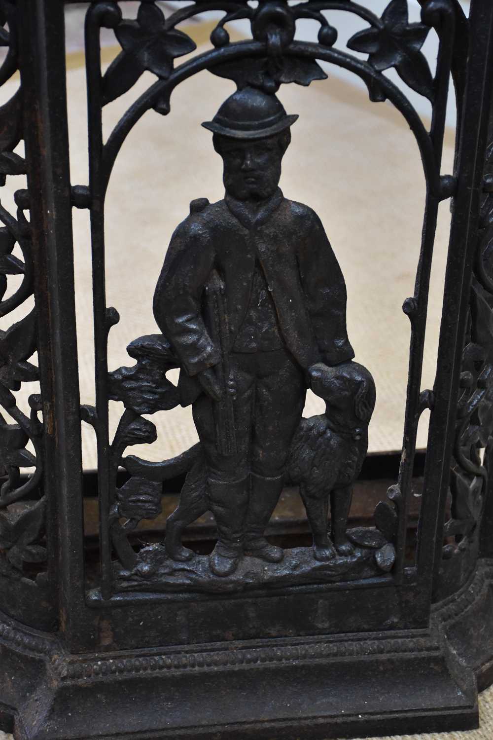 A cast iron stick stand, decorated with a sporting scene, height 78cm, and a cast iron boot - Image 3 of 4
