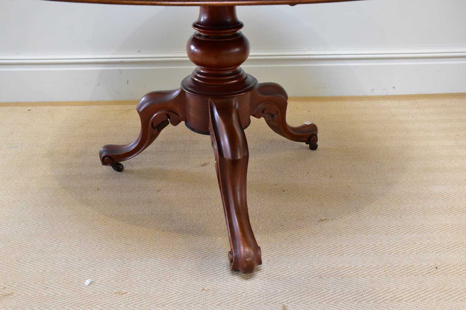 A Victorian mahogany tilt-top breakfast table on baluster and scrolling legs, diameter 114cm. - Image 3 of 3