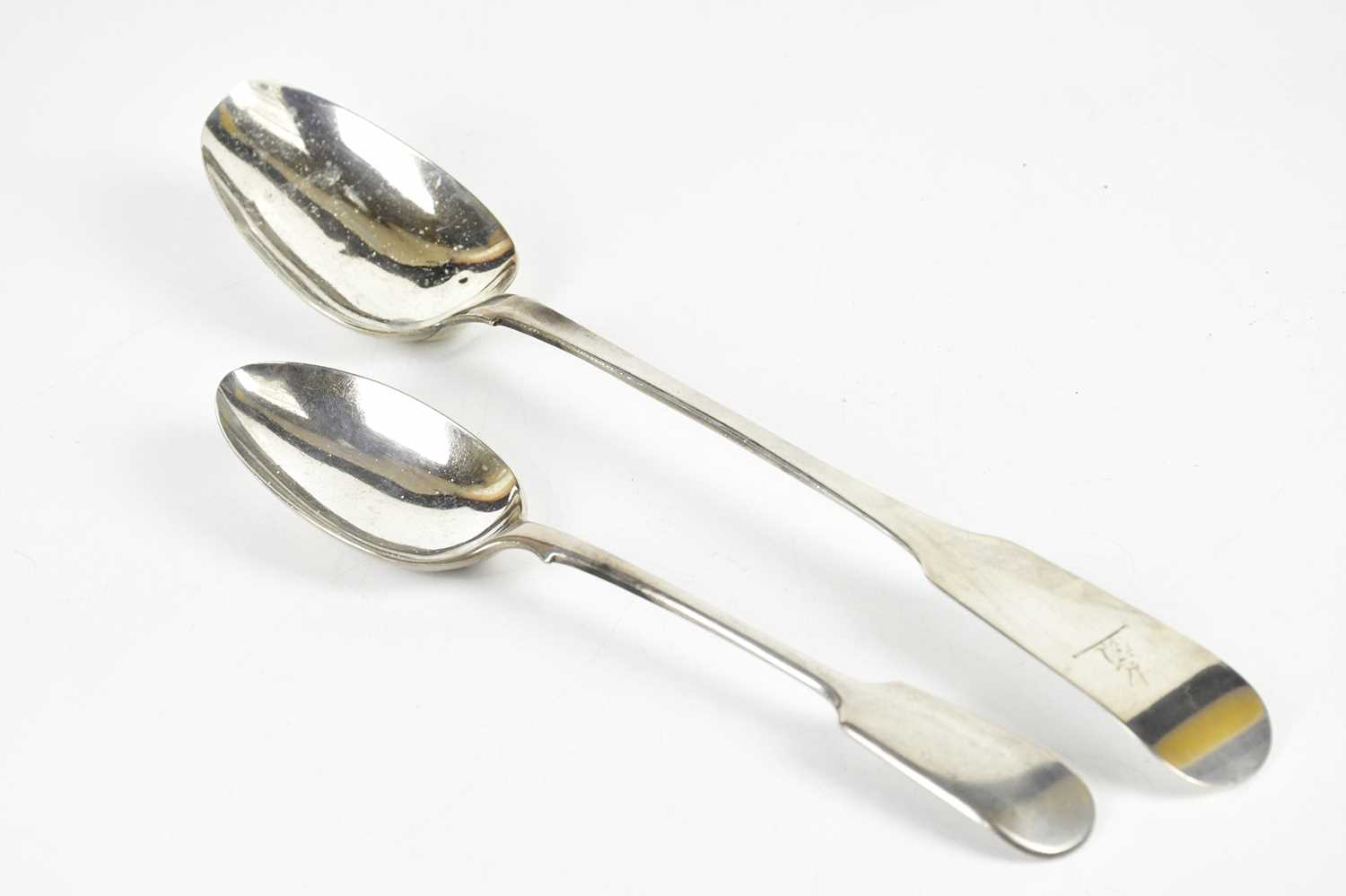 SAMUEL NEVILLE; a George III hallmarked silver serving spoon, Dublin 1817, and a smaller