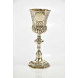 A Continental silver (probably Austrian) chalice, the hexagonal shaped bowl set with three coins and