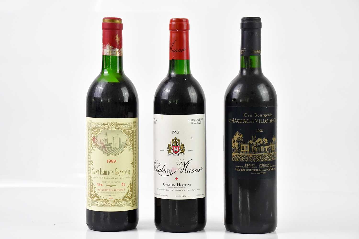 RED WINE; three bottles of mixed red wine including a bottle of Saint Émilion Grand Cru 1989, a