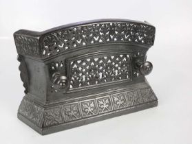 A Victorian painted cast iron fire surround of small proportions, relief decorated with an urn of
