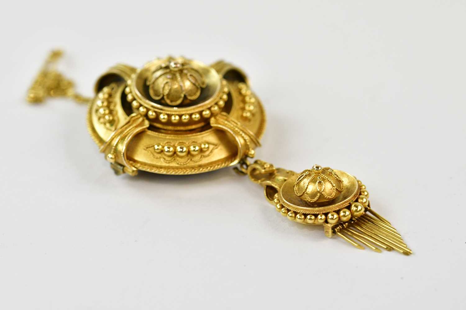 A Victorian yellow metal target brooch/pendant with cast decoration, height 5cm, approx 11.8g, - Image 2 of 3
