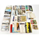A collection of postcards relating to television, geographic locations and transport.
