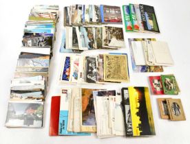 A collection of postcards relating to television, geographic locations and transport.